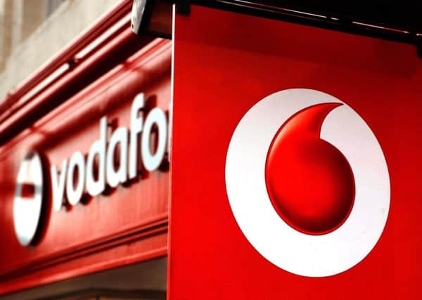File photo dated 02/11/10 of a general view of a Vodafone store as the mobile phone giant was poised to buy Germany's biggest cable operator in a deal worth £9.1 billion. PRESS ASSOCIATION Photo. Issue date: Monday June 24, 2013. The acquisition, which could still be derailed by rival interest from US media group Liberty Global, will boost Vodafone's ability to offer consumers bundled packages of telecoms, broadband and television services. See PA story CITY Vodafone. Photo credit should read: PA Wire