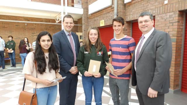 Left to right - Radhika Gupta; Banbridge Academy School Principal, Mr McLoughlin; Lily Spence; Chris Sayers and Mr Michael Crossan, Head of Examinations and Assessment at CCEA. The three students got all A*/A grades.