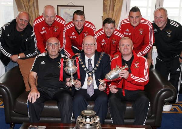 Mayor of Mid and East Antrim, Cllr. Billy Ashe, pictured with members of Harryville Homers, at a reception in the Mayors Parlour, recognising the clubs achievements over the last season. INBT34-261AC