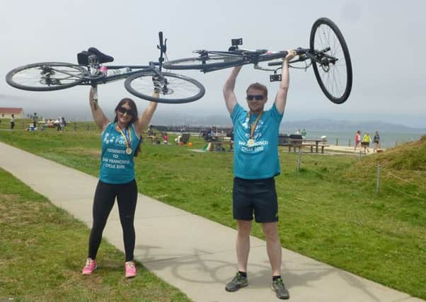 Grace and Sean celebrate finishing their charity cycle challenge in the USA. INNT-34-802CON