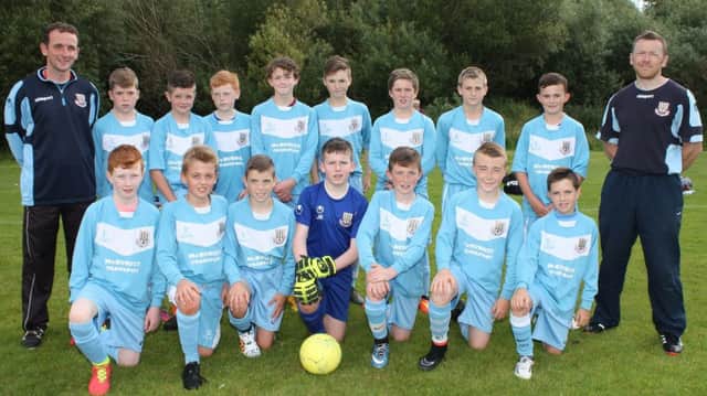 Ballymena United under-13s pictured at the Harry Gregg Foundation Festival of Football at Ulster University Coleraine with coaches Chris Coulter and Alan Millar.