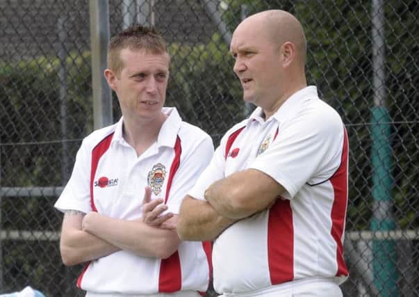 Andy Kyle and Paul Robinson discuss tactics at Glenarm Road against Ballymena. INLT 33-248-AM