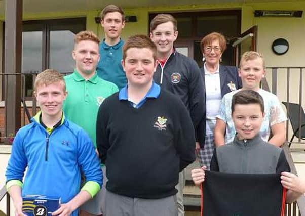Scott Nelson, the juvenile captain, with a group of prizewinners on his Captain's Day last Wednesday.