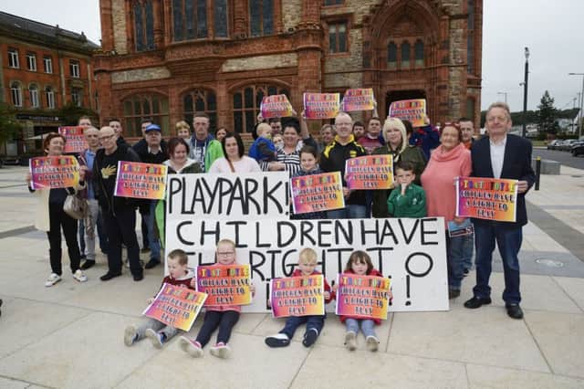 Residents of Strathfoyle who held a protest outside the Guildhall last week to highlight the lack of play facilities in the area. INLS3315-123KM