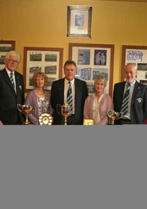 DEDICATE. Officials of Ballymoney RFC, John Campbell, Tom Skelton and Shaun Boyd, pictured with Linda and Vivien Hunter, Neices of the late Billy Nicholl, (Patron of BRFC), beside a cabinet dedicated in memory of Billy which will store all written records kept by him during his many years at the club.INBM34-15 014SC.