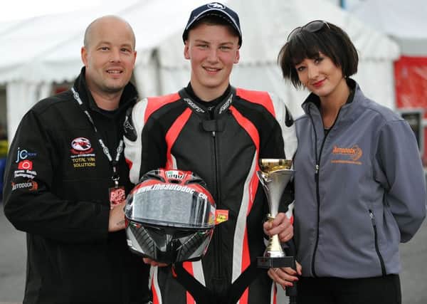 Aaron Wright with dad Chris and Kirsty Cross after finishing third at Thruxton. INLT 34-699-CON