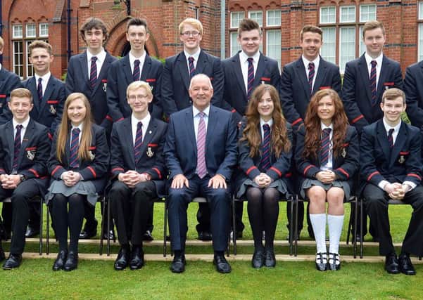 The top achievers at 'AS' level from Lurgan College pictured with school principal, Mr Trevor Robinson, front centre, following the announcement of results last week. INLM34-205.