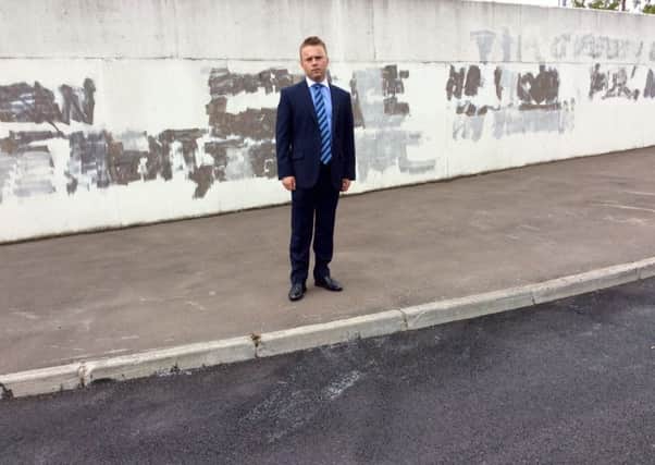 Cllr Thomas Hogg pictured at the former Felden site where the new Clanmil Housing development has been targeted by sectarian vandals.