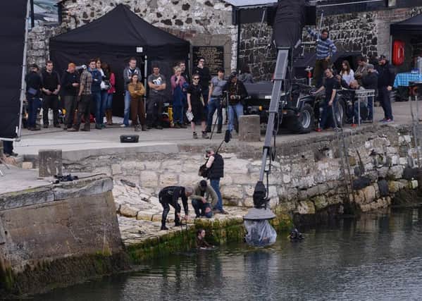 HBO's TV show Game of Thrones actress Maisie Williams, who plays Arya Stark, pictured getting into the water during filming at Carnlough. 
Picture By: Arthur Allison/Pacemaker Press
