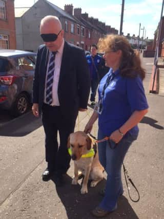 South Antrim DUP MLA Trevor Clarke who took part in a blindfolded walk at an event organised by Guide Dogs NI.