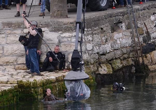 Game of Thrones actress Maisie Williams, who plays Arya Stark, pictured getting into the water during filming at Carnlough. 
Picture By: Arthur Allison/Pacemaker Press