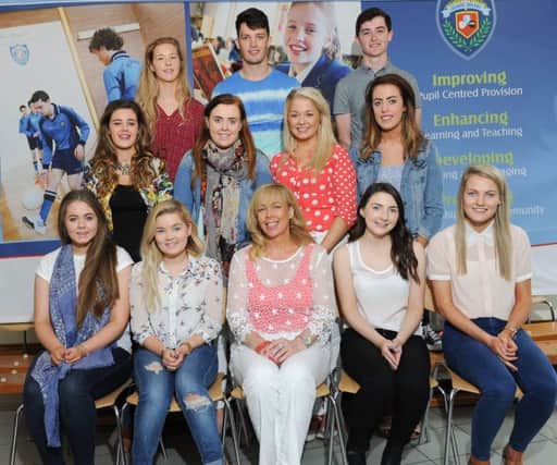 Deirdre Gillespie Principal of St Mary's Grammar School Magherafelt with students who ganied Two A's and more at A'Level.INMM3415-364