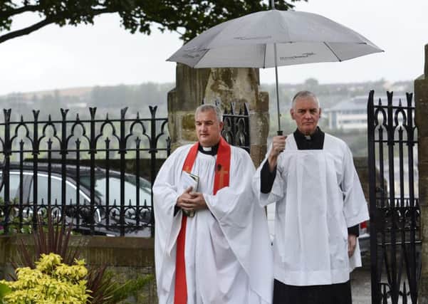 Rev Malcolm Ferry, Rector of St Augustine's Parish Church, where Marlene Jefferson was a member, and Fr Michael Canny, who participated in the funeral service,  arrive at St Augustine's Church on Wednesday. INLS3415-102KM