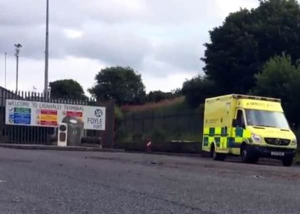 An ambulance leaving Lisahally Docks where it has been confirmed three men fell from a crane into the hold of a boat on Thursday morning.