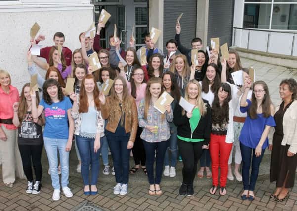 Students from Cambridge House Grammar School celebrate their excellent GCSE results. Included is Mrs. E. Lutton (Principal) and Mrs. McClurg. INBT35-217AC