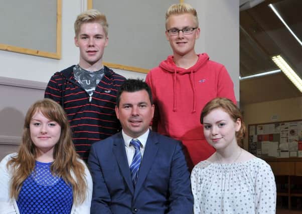 Rainey Endowed School Magherafelt Headmaster Mark McCullough with students who attained 6*/ A grades at GCSE level.INMM3515-324
