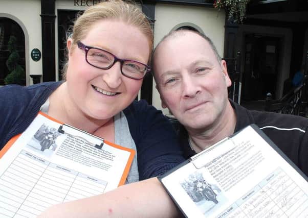 Lisa Hemphill and Cathal Cunning collecting signatures for the HEMS petition.
