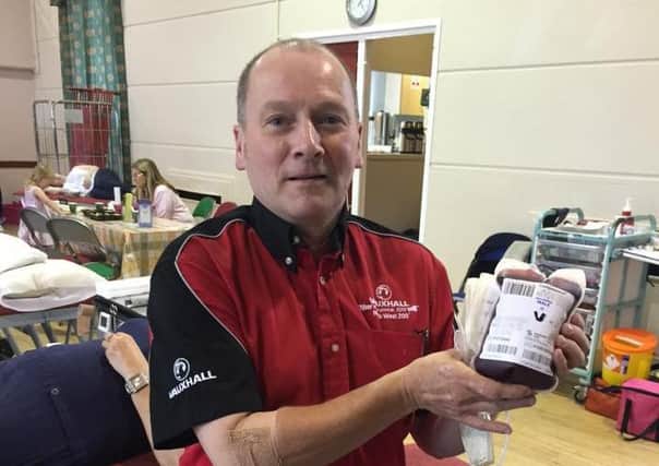 North west 200 Chief Mrshall Cathal Cunning donates #oneforhinds at a donation session held in Portstewart Town Hall