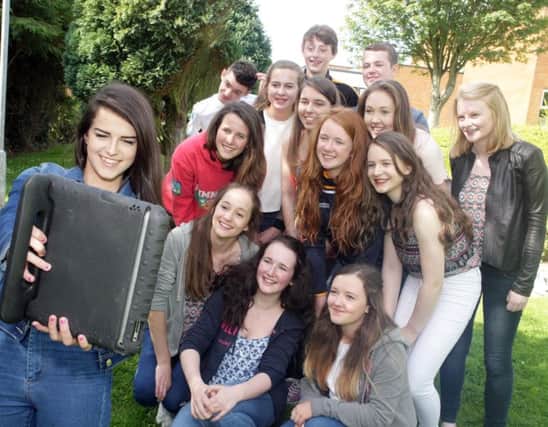 A SELFIE. Top pupils at Cross & Passion celebrate their results with a selfie on Thurs.INBM35-15 021SC.