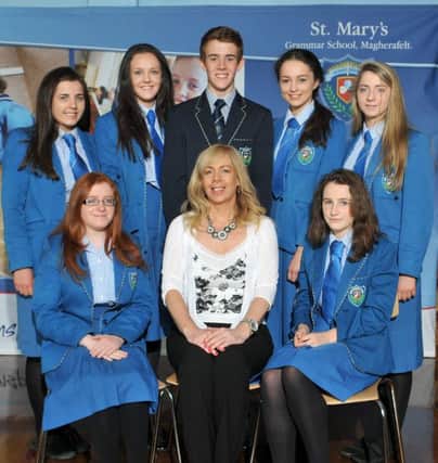 St Mary's Grammar School Principal Mrs Gillespie with students who achieved 11A's or more at GCSE level. They are Sarah Gallen, Emily Hinds, Meabh McGirr, Roseanna Mullan, Ciara Doyle, Orla McGurk and Ryan Rocks.INMM3515-332