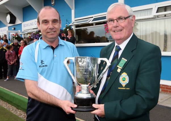 George Graham, President of Ballymena Bowling Club, is presented with the Irish Senior Cup runners-up trophy from Irish Bowling Association President Robert Madden.
 Picture: Press Eye.
