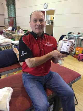 North west 200 Chief Mrshall Cathal Cunning donates #oneforhinds at a donation session held in Portstewart Town Hall