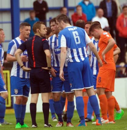 The moment Coleraine's challenge to Linfield faded when Davaid Ogilby was sent off for a non-existent challenge. Despite Linfield's Waterworth informing the referee there was no contact, Ogilby was harshly sent to the dresing room for two yellow cards.