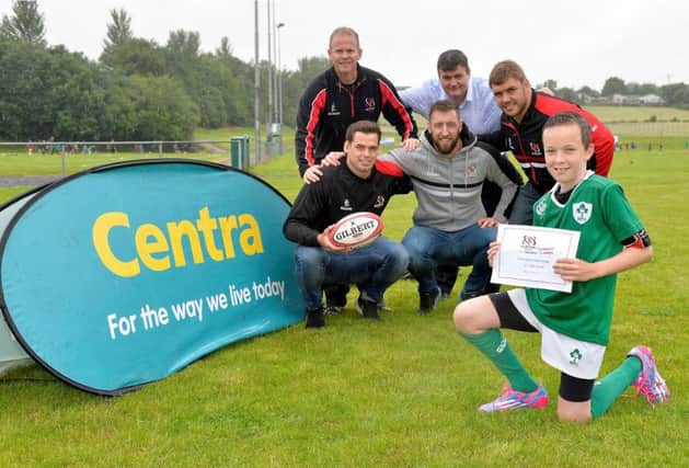 Ulster Rugby Players Peter Browne, Clive Ross and Wiehahn Herbst present the Best Skills Award to Harry Patterson, aged 12 from Banbridge along with camp manager Darren McGuigan and Frank McPolin, store owner of Centra Banbridge, Church Street at the Centra Ulster Rugby Summer Camp at Banbridge RFC.
