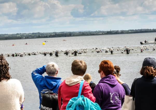 Perfect conditions as  hundreds of competitors take to the water in the Lough Neagh Triathlon.