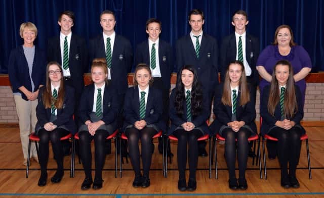 the top achieving GCSE pupils atLlismore Comprehensive School following the announcement of results last Thursday. Also included in the photo are Mrs Dolores Foster (vice principal), left, and Mrs Fiona Kane, principal), right. INLM35-203.