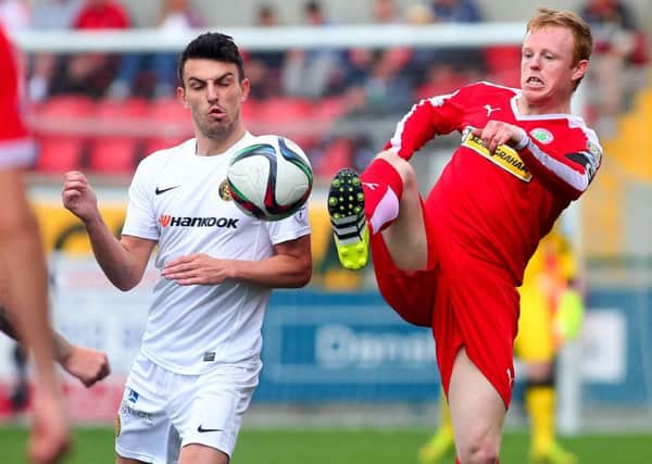 Cliftonville's George McMullan and Carrick's Conor McCloskey in action during the Danske Bank Premiership clash at Solitude. Picture: Press Eye