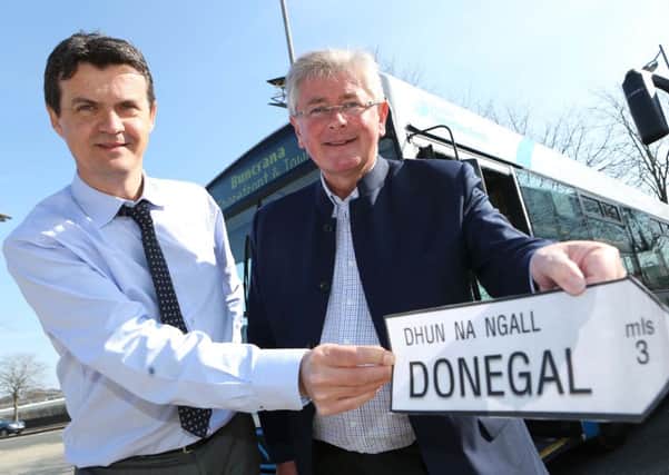 Translink Assistant Service Delivery Manager, Tony McDaid and Translink Ambassador Michael Doran launching a new Ulsterbus Service to Buncrana earlier this year. Sinn Féin want irish language signage on some local bus routes. The DUP don't.