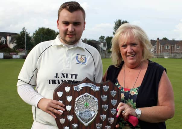 Newbuildings' Ross Hunter with his mother holding the Sammy Jeffrey Shield after their win over Creevedonnell in Saturday's final.