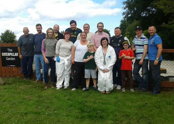 Volunteers from Caterpillar NI extended allotment at Corran Integrated Primary School.  INLT 35-665-CON