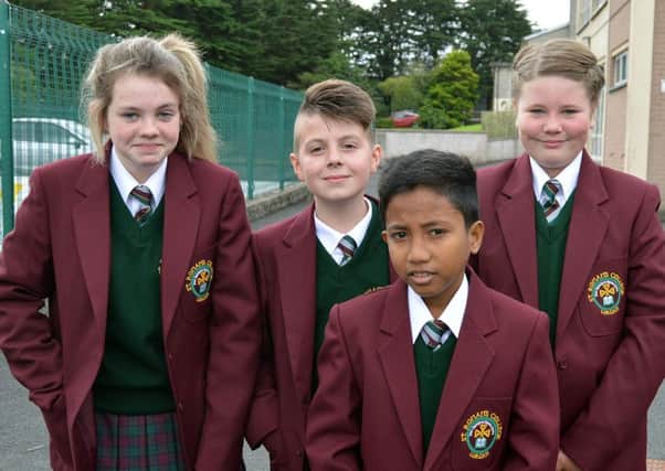 Pictured on their first day at the new St Ronan's College are Year 8 pupils from left, Rebecca O'Brien, Shea Shortt, Delme Caldoso and Shannon Breen. INLM36-203.