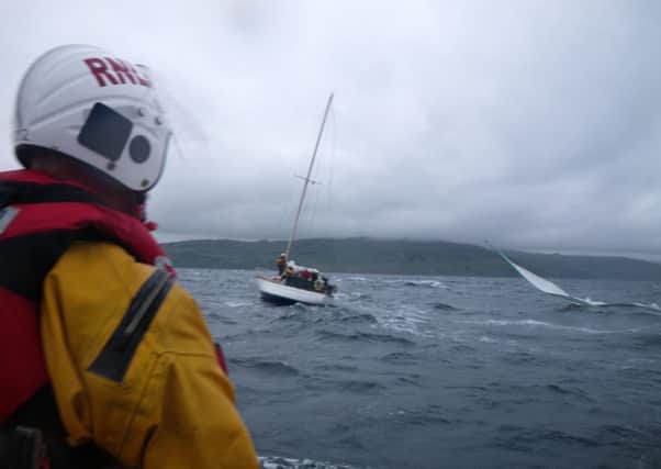 RNLI crew come to the assistance on a yacht in danger at Torr Head.  INLT 36-650-CON