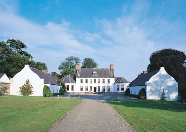 The house is flanked on either side by a long low building. These outbuildings were used by servants, the senior staff occupying the building on the left and the junior staff the building on the right.