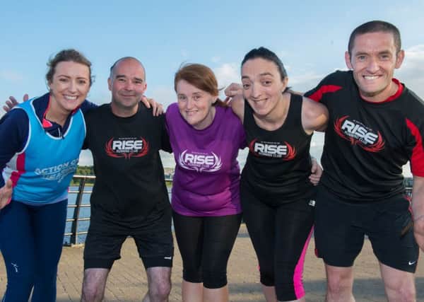 Stephanie O'Kane from Action on Hearling Loss with Daniel McDaid, Annette Devenney and Lisa Dawson and Tommy McCallion, RISE Running Club. Picture Martin McKeown. Inpresspics.com.