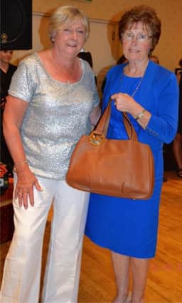 Winner Brenda Maxwell receives her prize from the Lady President, Maureen Bryson.