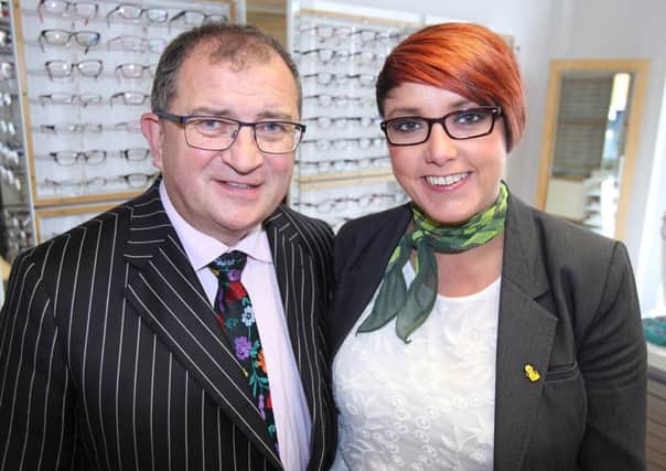 Sam Baird, from Baird's Opticians, with Kim Murdock who is leaving after working in the shop for 21 years as an optical assistant to take up a new career as a midwife. US1535-508cd  Picture: Cliff Donaldson