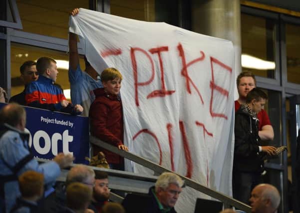 A section of United supporters unveiled a banner bearing the slogan 'Spike Out' at Friday night's game. Picture: Pacemaker Press.