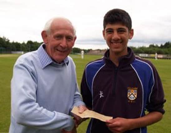 Varun Chopra of Coleriane receives the Danske Bank Performance of the round award from Strabane and NW legend Paddy Gillespie last season.