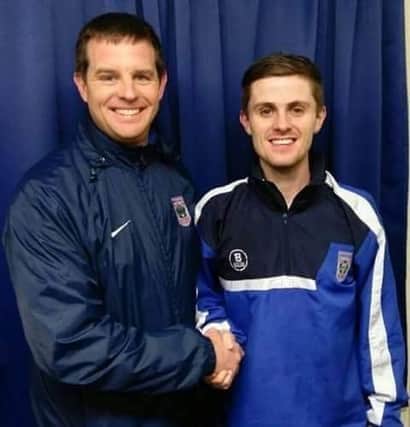 Johnny Kernaghan congratulated by manager DJ on scoring the winning penalty.
