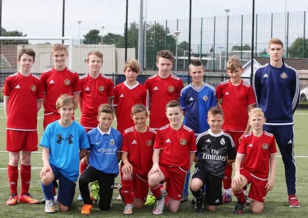 Carniny Youth Under 14s who took part in the Sunderland FC  Foundation of Light Programme are seen here with Sunderland FC Early Years specialist Adam Doherty. INBT 36-170CS