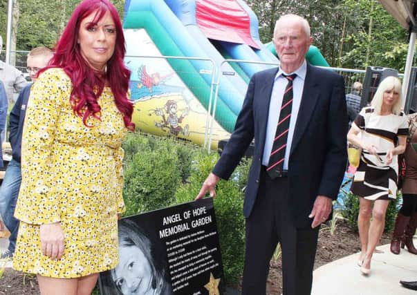 Harry Gregg former Irish International goalkeeper offically opens The 'Angel of Hope' Memorial Garden in Coleraine on Sunday afternoon. With Harry is Andrea McAleese who Campaigned for the garden in memory of her daughter Roma who was killed six years ago outside her Coleraine home after being struck by a car.PICTURE MARK JAMIESON.