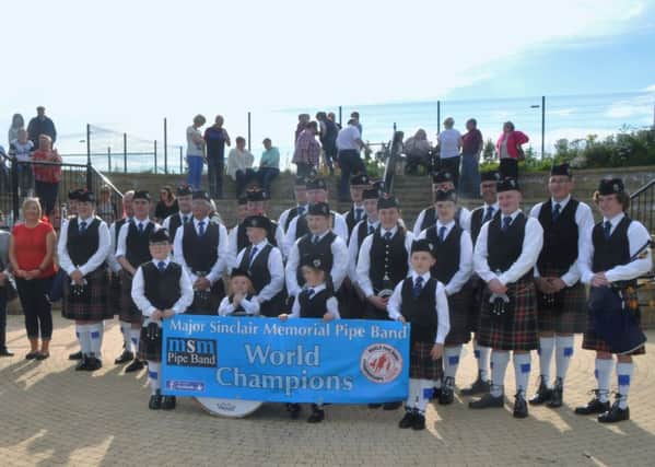 The Major Sinclair Memorial  Pipe Band together with locals at the opening ceremony of the Broadisland Gathering in Fairhill Ampitheatre. INLT-36-700-con
