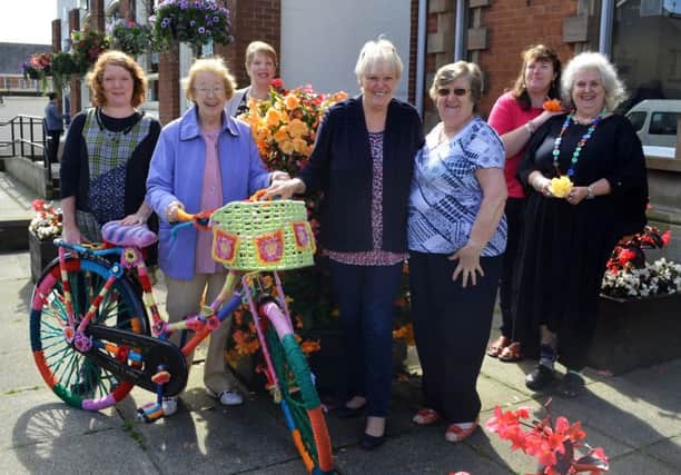 Lighthouse Yarns, Whitehead, was a runner-up in the best kept commercial premises category of the Carrickfergus in Bloom commmunity competitions, owner Louise Williamson (left) is pictured with knitting group members. INCT 35-752-CON