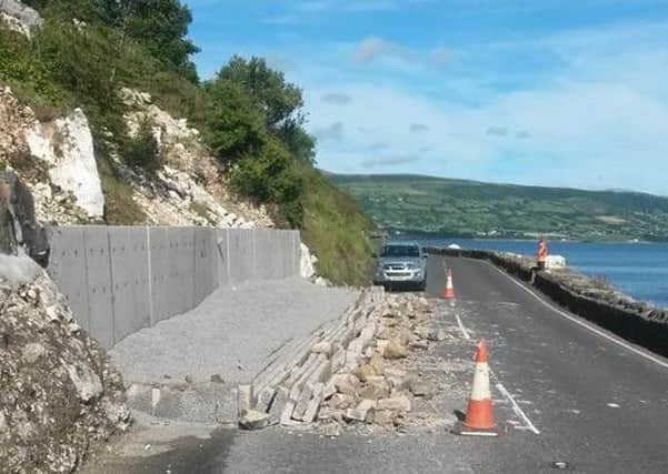 The remains of the collapsed wall pictured lying in the road outside Glenarm. INLT-36-709-con