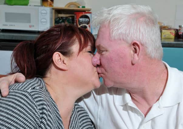 Heart attack survivor Thomas Curran gets a kiss from his wife Barbara. INMM3615-440