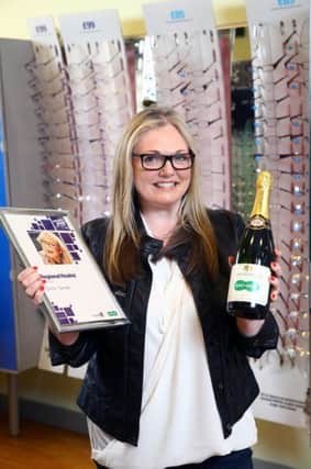 Dromara lady Donna Davison shows off her specs appeal after she was named a regional finalist in Specsavers' Spectacle Wearer of the Year competition.